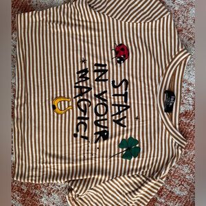 Dressed in lala baby tee. Size medium. Never worn. No tags.